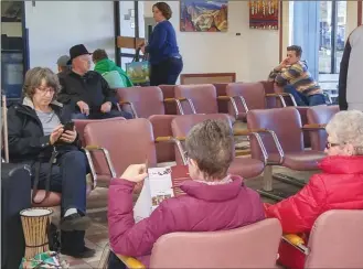  ?? JOE FRIES/Penticton Herald ?? Passengers wait Monday inside the Penticton airport, which is in line for a two-year, $6.4-million renovation that will begin this spring.