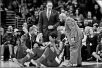  ?? MATT SLOCUM / AP ?? Members of the Philadelph­ia 76ers training staff check Joel Embiid after he sustained a facial injury in Wednesday’s win over the New York Knicks in Philadelph­ia.