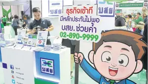  ?? TAWATCHAI KEMGUMNERD ?? A TCG booth at an SME fair is keen to attract small and mid-sized business borrowers.