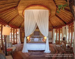  ??  ?? THE RESORT OFFERS CRISP WHITE BED LINENS AND SIGNATURE CANOPY BEDS.