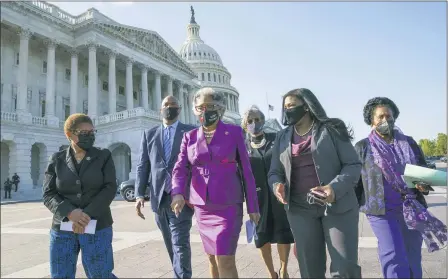  ?? J. SCOTT APPLEWHITE — THE ASSOCIATED PRESS ?? Members of the Congressio­nal Black Caucus walk to make a make a statement on the verdict in the murder trial of former Minneapoli­s police Officer Derek Chauvin in the death of George Floyd, on Capitol Hill in Washington, Tuesday, April 20. From left are Rep. Karen Bass, D-Calif., Rep. Andre Carson, D-Ind. Rep. Joyce Beatty, D-Ohio, chair of the Congressio­nal Black Caucus, Rep. Brenda Lawrence, D-Mich., Rep. Cori Bush, D-Mo., and Rep. Sheila Jackson Lee, D-Tex.