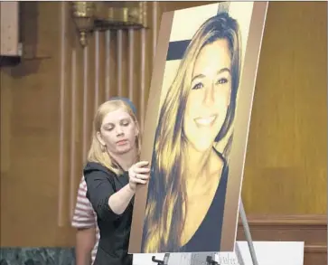  ?? Michael Reynolds
European Pressphoto Agency ?? AT A SENATE PANEL hearing in Washington, a portrait of Kathryn Steinle, who was fatally shot on San Francisco’s Pier 14, is displayed. The immigrant charged in her killing had been deported to Mexico five times.