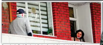  ?? ?? Dropping in: Boris Becker talks to a female friend outside her flat