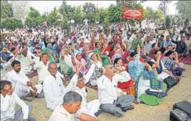  ??  ?? Striking roadways employees and staff of other department­s staging a dharna in Rohtak; roadways buses parked at the local bus stand on Tuesday.