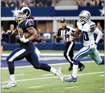  ?? AP/MICHAEL AINSWORTH ?? Los Angeles Rams running back Todd Gurley sprints to the end zone past Dallas Cowboys cornerback Anthony Brown on a 53-yard pass play during the third quarter of Sunday’s game in Arlington, Texas. Gurley finished the game with 215 all-purpose yards.