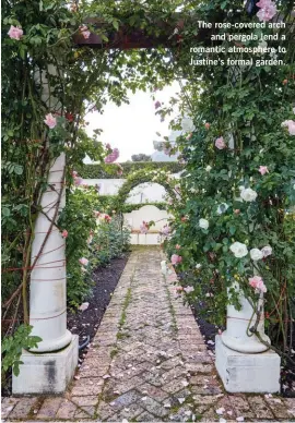  ??  ?? The rose-covered arch and pergola lend a romantic atmosphere to Justine’s formal garden.