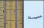  ?? REUTERS ?? Air Force One departs Las Vegas past the broken windows on the Mandalay hotel where shooter Stephen Paddock conducted his mass shooting on Wednesday.