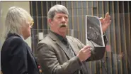  ?? JAMESON COOK — THE MACOMB DAILY ?? Auto mechanic expert James Idema, right, next to defense attorney Dennis Johnston, shows a photo to a Macomb County Circuit Court jury Tuesday while testifying for the defense in the trial of Timothy Otto.