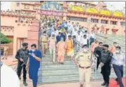  ?? HT PHOTO ?? Chief Minister Yogi Adityanath climbing down stairs of Sri Krishna Janambhoom­i in Mathura on Monday.