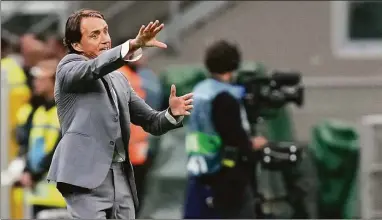  ?? Antonio Calanni / Associated Press ?? Italy coach Roberto Mancini reacts during the UEFA Nations League soccer match between Italy and England on Sept. 23 at the San Siro stadium, in Milan, Italy.