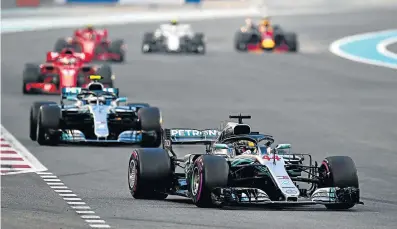  ?? Picture: Clive Mason/GETTY IMAGES ?? ROARING TO THE FINISH: Lewis Hamilton of Great Britain driving the (44) Mercedes leads Valtteri Bottas driving the (77) Mercedes AMG Petronas at the Abu Dhabi Formula One Grand Prix at Yas Marina Circuit on Sunday.