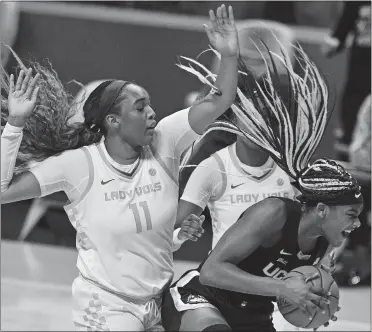  ?? SAUL YOUNG/KNOXVILLE NEWS SENTINEL VIA AP, POOL ?? UConn’s Aaliyah Edwards (3) attempts to keep a ball in bounds while defended by Tennessee’s Kasiyahna Kushkituah (11) during Thursday’s game in Knoxville, Tenn.