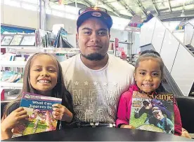  ?? Picture / Sarah Harris ?? Otele Etuale brought his daughters Malaea, 7, and Imeleta, 6, to the Clendon library to read but would never leave them unsupervis­ed.