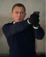  ?? Nicola Dove ?? Daniel Craig steps into Bond’s shoes one last time in “No Time to Die."