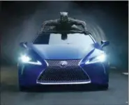  ??  ?? This photo provided by Lexus shows an image of the Lexus “Black Panther” Super Bowl spot.