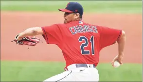  ?? Ron Schwane / TNS ?? Former Indians pitcher Carlos Carrasco strained his right hamstring during conditioni­ng after throwing one inning of batting practice Thursday for the Mets and seems certain to miss the start of the season.