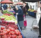  ??  ?? ATHENS: People shop at a green market in central Athens on Friday. The Greek Seamen Federation (PNO) decided to extend its strike until December 11, 2016. All kinds of ferries and ships have been docked at the ports since December 2, leading to...