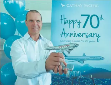  ??  ?? MILESTONE: Cathay Pacific’s Howard Field marks the special day yesterday at Cairns Airport.