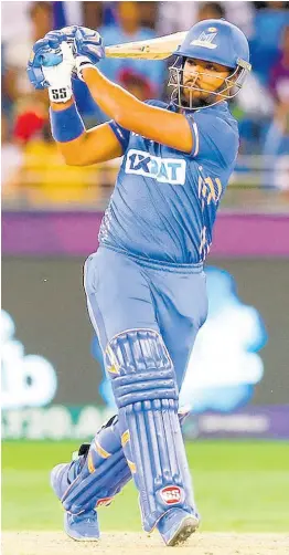  ?? COURTESY OF @ILT20OFFIC­IAL ?? Mumbai Indian Emirates Nicholas Pooran pulls on his way to 57 during the final of the Internatio­nal League Twenty20 against the Dubai Capitals at the Dubai Internatio­nal Cricket Stadium in the United Arab Emirates yesterday.