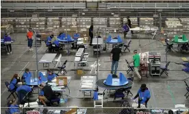  ?? Photograph: Matt York/AP ?? Maricopa county ballots cast in the 2020 general election are examined and recounted by contractor­s working for Florida-based company, Cyber Ninjas, in Phoenix on 6 May 2021.