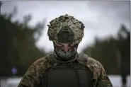  ?? DANIEL COLE — THE ASSOCIATED PRESS ?? A Ukrainian serviceman controls a drone during a demonstrat­ion close to the border with Belarus, Ukraine, Wednesday.