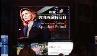  ?? CHIANG YING-YING/ASSOCIATED PRESS ?? People walked past a billboard welcoming House Speaker Nancy Pelosi in Taipei, Taiwan, Tuesday.