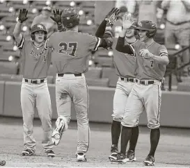  ?? Juan DeLeon ?? The Bearkats celebrate at home after scoring three runs in the ninth to salt away the 7-1 win over New Orleans. Blake Chisolm (27) drove in two runs with a triple and scampered home for the final run when the throw home got away.