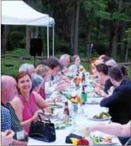  ??  ?? Attendees enjoy dinner at the Enchanted Forest event.