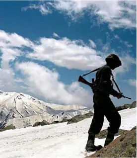  ??  ?? Flashpoint: An Indian soldier on patrol in the disputed region