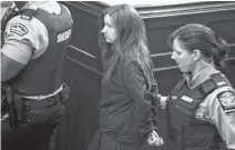  ??  ?? Victoria Henneberry is escorted from a Halifax courtroom in July 2014. She and her boyfriend Blake Leggette are serving life sentences for killing Loretta Saunders.