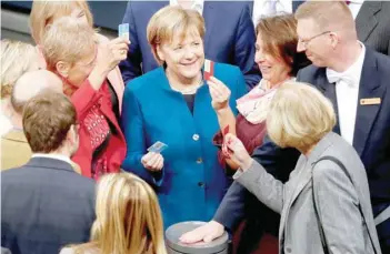  ?? — Reuters ?? Chancellor Angela Merkel attends a voting on the government’s budget during a session at the lower house of parliament Bundestag in Berlin, on Wednesday.