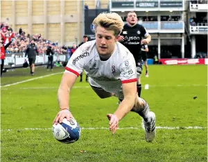  ??  ?? Flying wing: Rob Lyttle wins the race to touch down for Ulster at the Rec yesterday