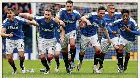  ??  ?? SPOT OF BOTHER: the Celtic players (top) suffer shoot-out agony as Rangers (above) get the better of them in the Scottish Cup semi-final two years ago