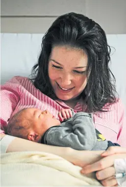  ?? Picture: Andrew Cawley. ?? Lucy Lintott, who suffers from MND, with baby boy LJ at Aberdeen Maternity Hospital.