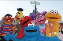  ?? KATHY WILLENS — THE ASSOCIATED PRESS FILE ?? In this file photo, characters from Sesame Street Live appear on the street by Madison Square Garden to celebrate the 30th anniversar­y of the live touring stage shows based on the PBS television series. in New York.