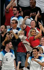  ?? ?? Party time: the players’ families celebrate in the stands as the Three Lions march into the last eight