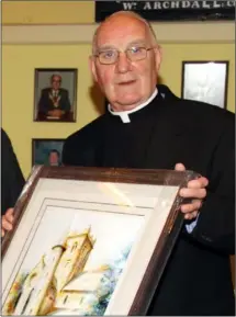  ??  ?? Monsignor Kehoe at a civic reception held for him at Gorey Town Council in July 2010. RIGHT: Monsignor Kehoe at the Patron at Rossminogu­e graveyard in June 2013.