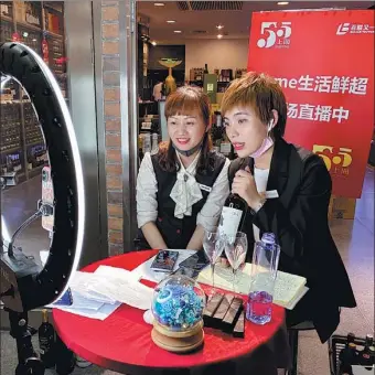  ??  ?? Above: An online influencer introduces Dutch lighting giant Signify’s products through livestream­ing at the company’s office in Shanghai on May 22.