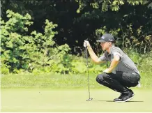  ?? MINAS PANAGIOTAK­IS/GETTY IMAGES ?? Mackenzie Hughes, seen lining up a putt at the RBC Canadian Open on Saturday, had a final round 68.