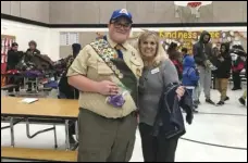  ?? Photo courtesy of Susan Summers ?? Eagle Scout candidate Timothy Carrino (left) stands next to Manzanita Elementary School Principal Susan Summers (left) during his visit to the school Monday to distribute jackets to needy students as part of his Eagle Scout project.