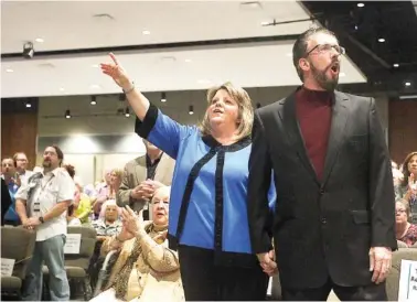  ?? STAFF FILE PHOTO ?? Evangelist Perry Stone sings with his wife, Pam, during a worship service at his annual conference, called “The Main Event,” at the Omega Center Internatio­nal in Cleveland, Tenn., in 2013.