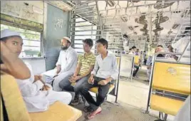  ?? ARUN SHARMA/HT ?? Junaid Khan’s brothers travel in the local train in which the 16yearold was lynched. The mood in the compartmen­t turns grim when someone mentions the teenager’s killing.
