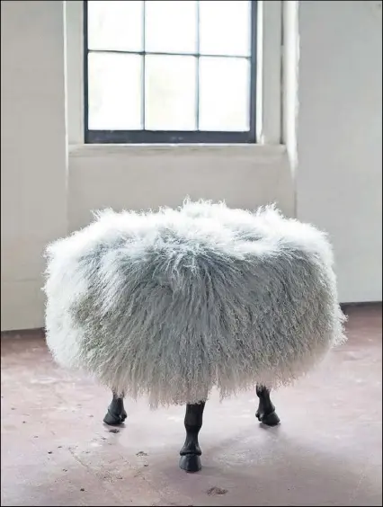  ?? CONTRIBUTE­D BY WWW.VANCOLLIER.COM ?? This Tibetan wool-covered ottoman sits on three carved horse hoof legs. Designed and made in North Carolina by VanCollier, the whimsical Finn Ottoman is available in custom sizes and finishes.