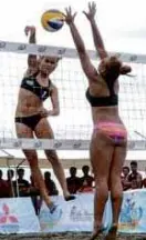 ??  ?? UST’s Cherry Rondina (left) goes for a kill.