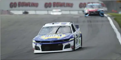  ??  ?? Chase Elliott (9) heads into turn one during a practice run for the NASCAR Cup Series at Watkins Glen Internatio­nal, on Saturday, in Watkins Glen, New York. AP PHOTO/JOHN MUNSON