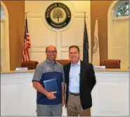  ?? SUBMITTED PHOTO — COURTESY OF HATFIELD TOWNSHIP ?? Hatfield commission­ers’ President Tom Zipfel, at right, stands with Charles Murgia Jr., son of longtime Hatfield Township Municipal Authority volunteer Charles Murgia, who passed away in April and was recognized May 24 for 47 years of service on the...