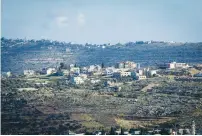  ?? (Yehonatan Kellerman/TPS) ?? THE WEST BANK village of Abu Shukheidim , north of Ramallah, where the terrorist involved in the Givat Assaf shooting was captured.