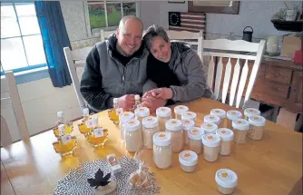  ?? PHOTO BY SALLY CRAGIN ?? Greg and Yanina Burns show off some of their maple products at Oak Tree Homestead in Lunenburg.