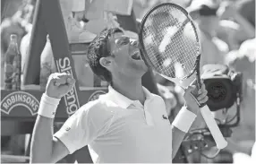  ??  ?? Serbia’s Novak Djokovic celebrates winning the Wimbledon men’s singles final match against Kevin Anderson on Sunday in London. KIRSTY WIGGLESWOR­TH/AP