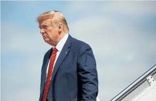 ?? EVAN VUCCI THE ASSOCIATED PRESS ?? U.S. President Donald Trump steps off Air Force One after arriving at Andrews Air Force Base on Thursday. Despite consuming much of the Trudeau government’s time in office, Trump has barely been mentioned in the federal election campaign.